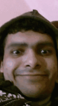a close up of a man 's face with his eyes closed