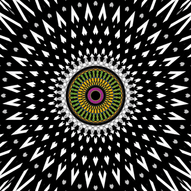 a black and white circular pattern with a yellow center