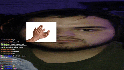 a screenshot of a man 's face with a picture of a hand on it