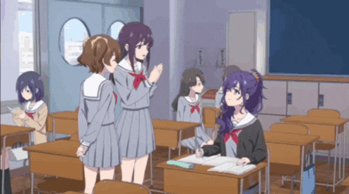 a group of anime girls are standing in a classroom talking to each other