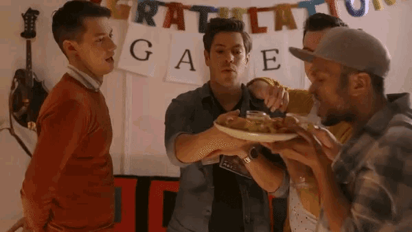 a group of men are gathered in front of a banner that says gratulation