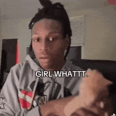 a man with dreadlocks is holding a piece of bread in his hand and says girl whattt .