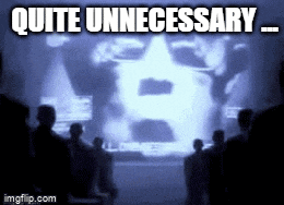 a group of people looking at a screen with the words quite unnecessary