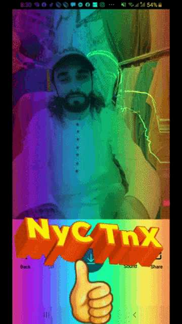 a phone screen shows a man giving a thumbs up and the word nyc thx
