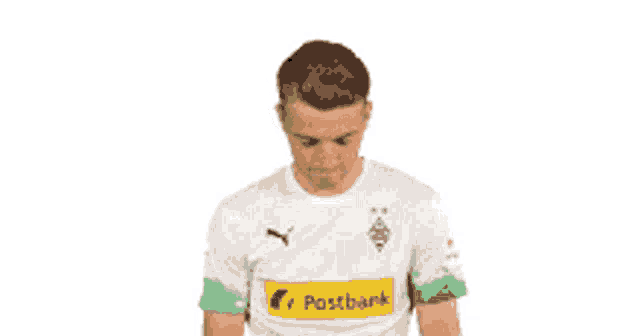 a soccer player wearing a white and green postbank shirt