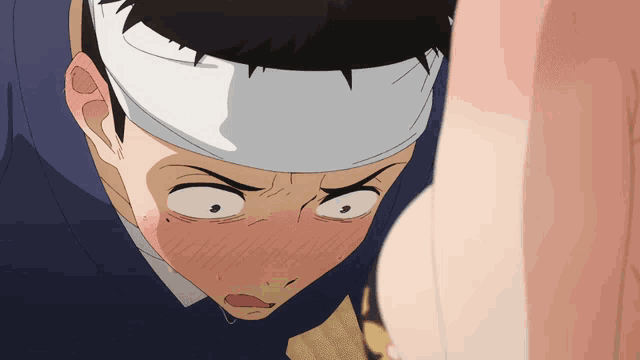 a man with a bandage on his head looks at a woman