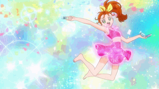 a girl with red hair and a yellow bow on her head is blowing soap bubbles