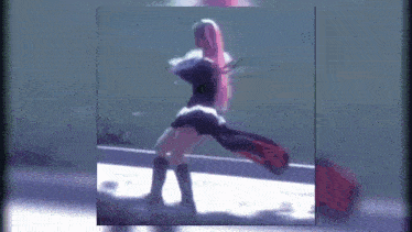 a blurred image of a woman in a black and white outfit