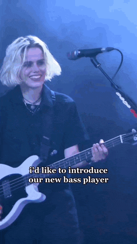 a person playing a guitar with the words id like to introduce our new bass player