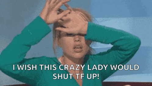a woman is covering her face with her hands and says i wish this crazy lady would shut tf up .