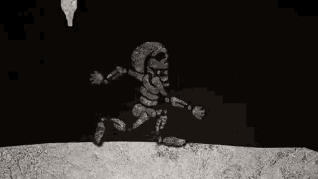 a black and white drawing of a skeleton standing on top of a rock .