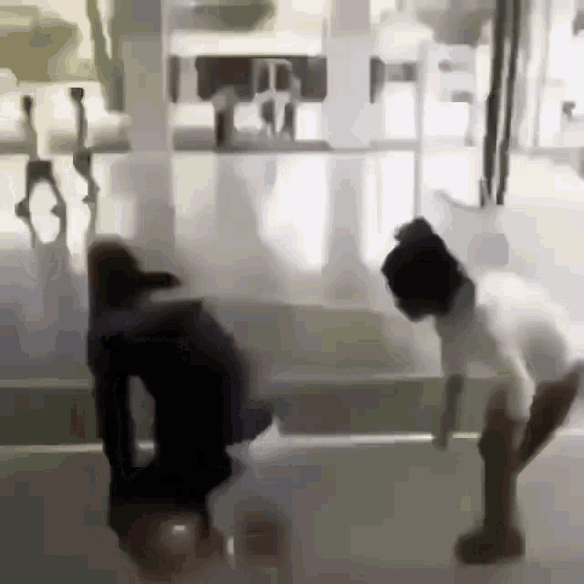 a blurry picture of a person bending over