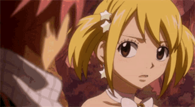 a boy and a girl are looking at each other and the girl has a star in her hair