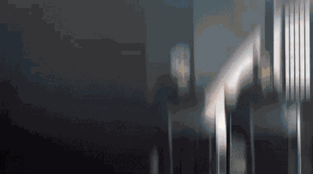 a blurred image of a person walking down stairs