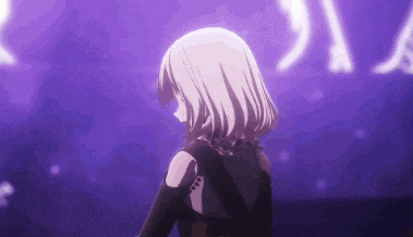 a girl is standing in front of a purple background in a dark room .