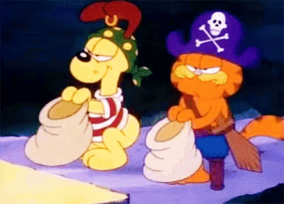 garfield is wearing a pirate hat and holding a bag of sand