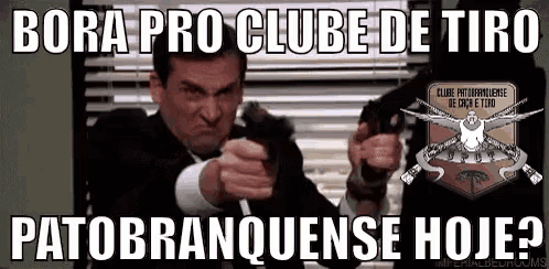 a man in a suit and tie is pointing a gun at another man in a suit and tie .