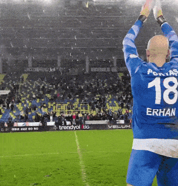 a soccer player with the number 18 on the back of his shirt