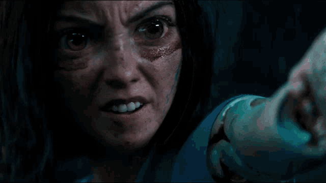 a picture of a woman with blood on her face and the words fuck your mercy