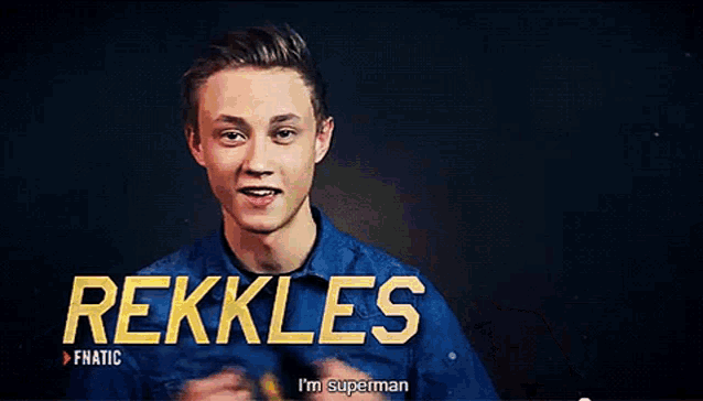 a young man in a blue shirt is holding a banana and says i 'm superman