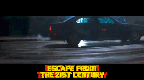 a car driving down a street with the words escape from the 21st century
