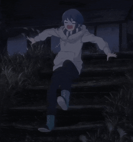 a girl in a hoodie is standing on a set of stairs with her arms outstretched