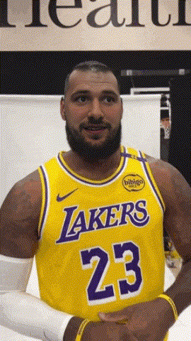 a man with a beard wearing a lakers jersey number 23