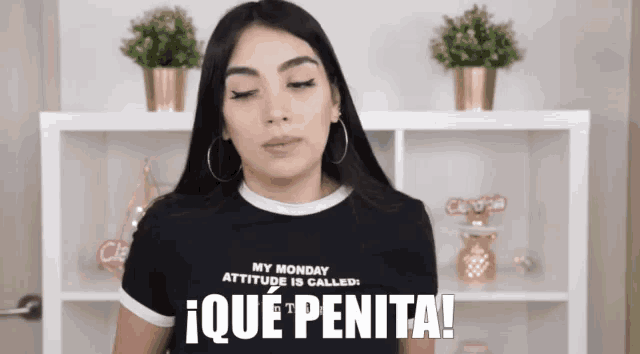 a woman wearing a t-shirt that says my monday attitude is called ique penita