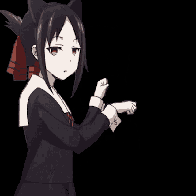 a girl with cat ears is wearing a black dress and a red bow .