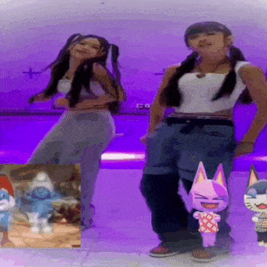 two girls are dancing in front of a smurf cartoon