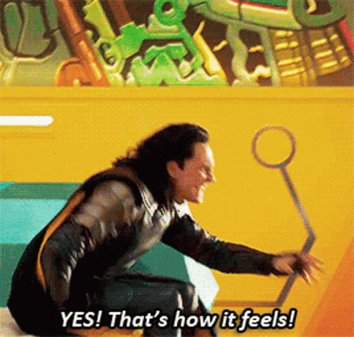 a man in a superhero costume is saying yes that 's how it feels .