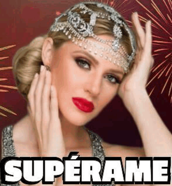 a woman wearing a tiara and red lipstick is holding her hands to her face .