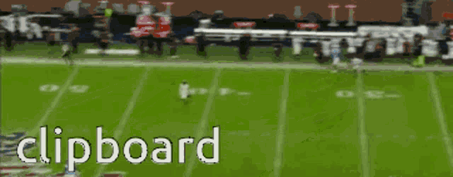 a clipboard shows a football game being played on a field
