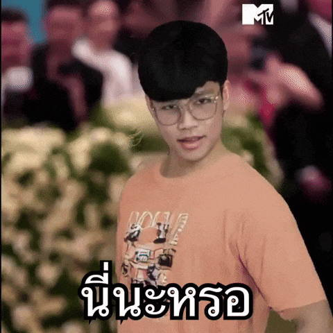 a man wearing glasses and a t-shirt that says mtv