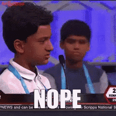 a boy stands in front of a microphone with the word nope on the bottom