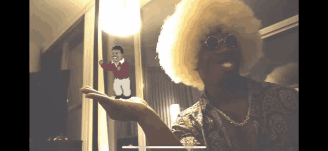 a man with a big afro is holding up a cartoon character