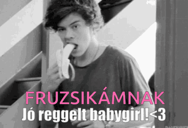 a black and white photo of a man eating a banana with the caption fruzsikannak jo reggedt babygirl < 3
