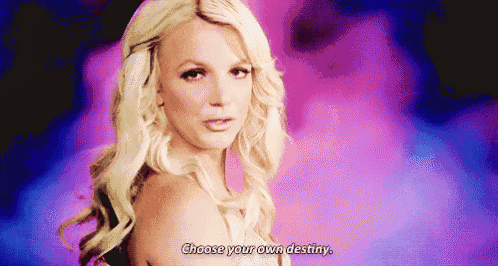 britney spears is standing in front of a purple background and says `` choose your own destiny '' .