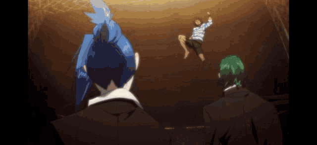 a man with blue hair is laying on the floor while two other men look on