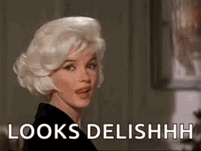 a woman with blonde hair is making a funny face and says `` looks delishh '' .