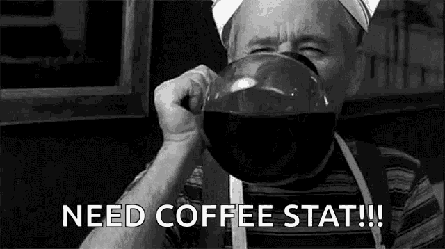 a man is drinking a large cup of coffee and saying `` need coffee stat '' .