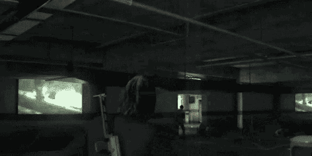 a pixelated image of a person in a parking garage