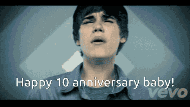 a video of a boy singing says happy 10 anniversary baby