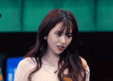 a woman wearing a name tag that says lonely