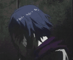a close up of a person 's face with blue hair and a purple jacket .