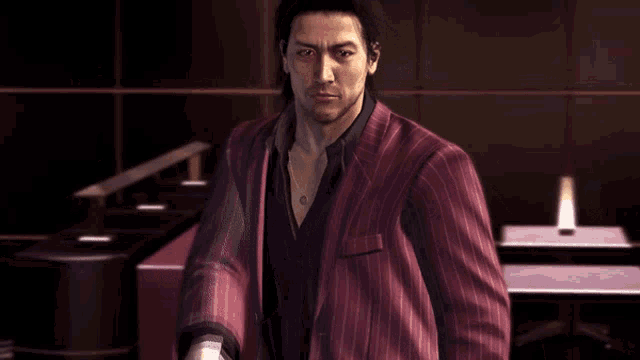 a man in a red striped suit is pointing his finger