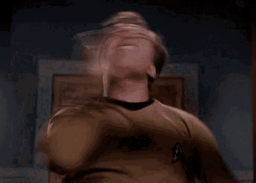 a man in a star trek uniform is dancing