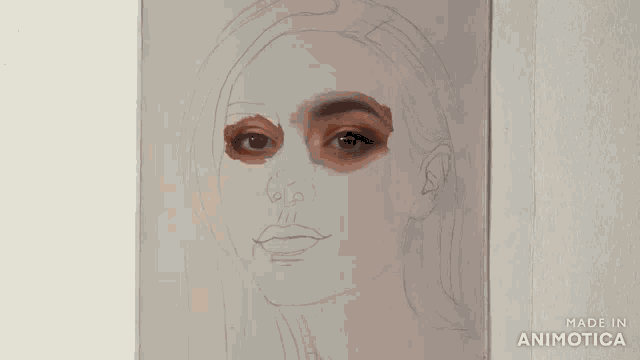 a person is painting a woman 's face with a brush that says made in animotica