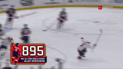 a hockey game is being played and the scoreboard shows that alex ovechkin has scored 895 goals