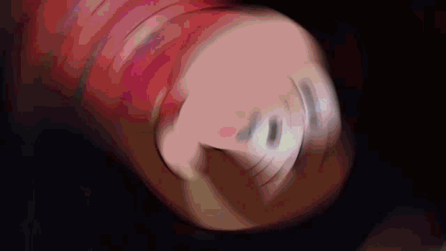 a close up of a person 's fist in a dark room .